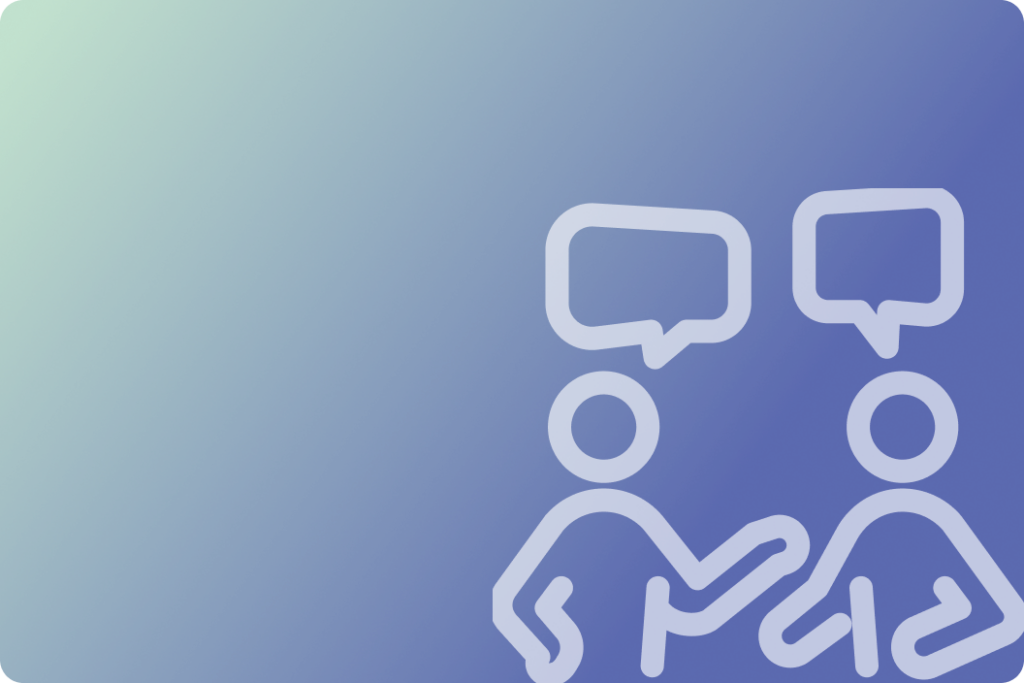 Two people sitting together, each with a speech bubble above their head, representing conversation at a conference