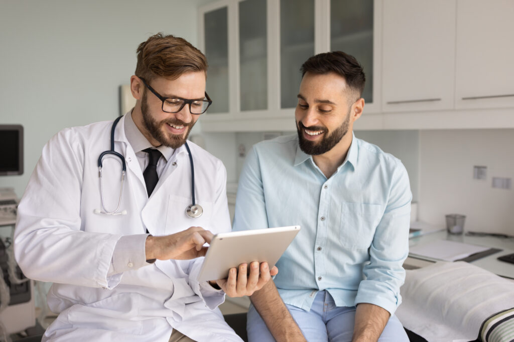 Doctor and patient discussing medical records on tablet