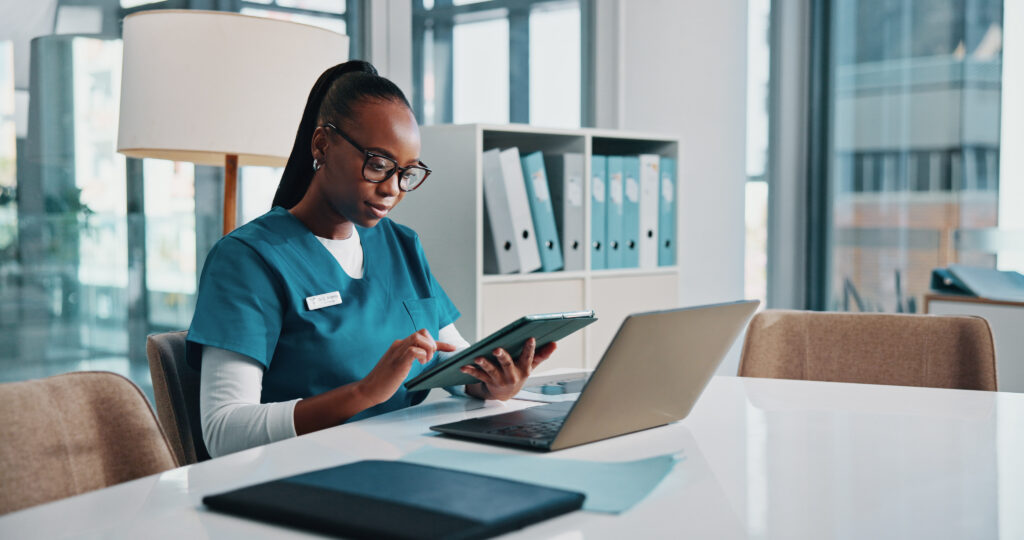 Doctor at a hospital researching using a tablet